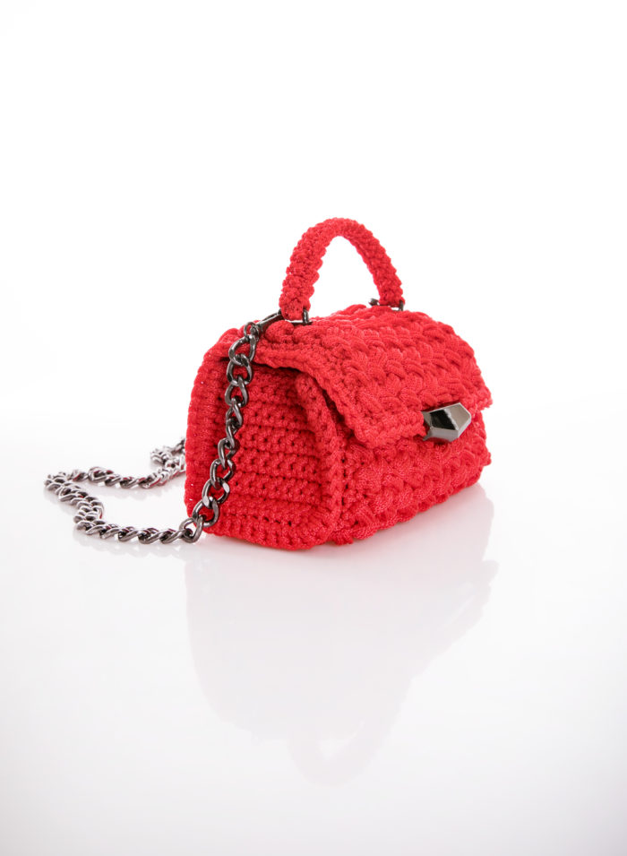 red handmade crochet flapbag in right side vew