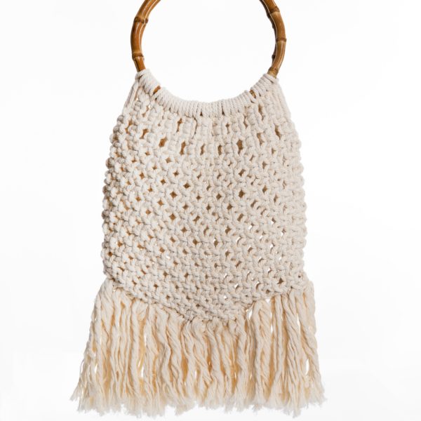 a handmade macrame bag in natural white cotton rope