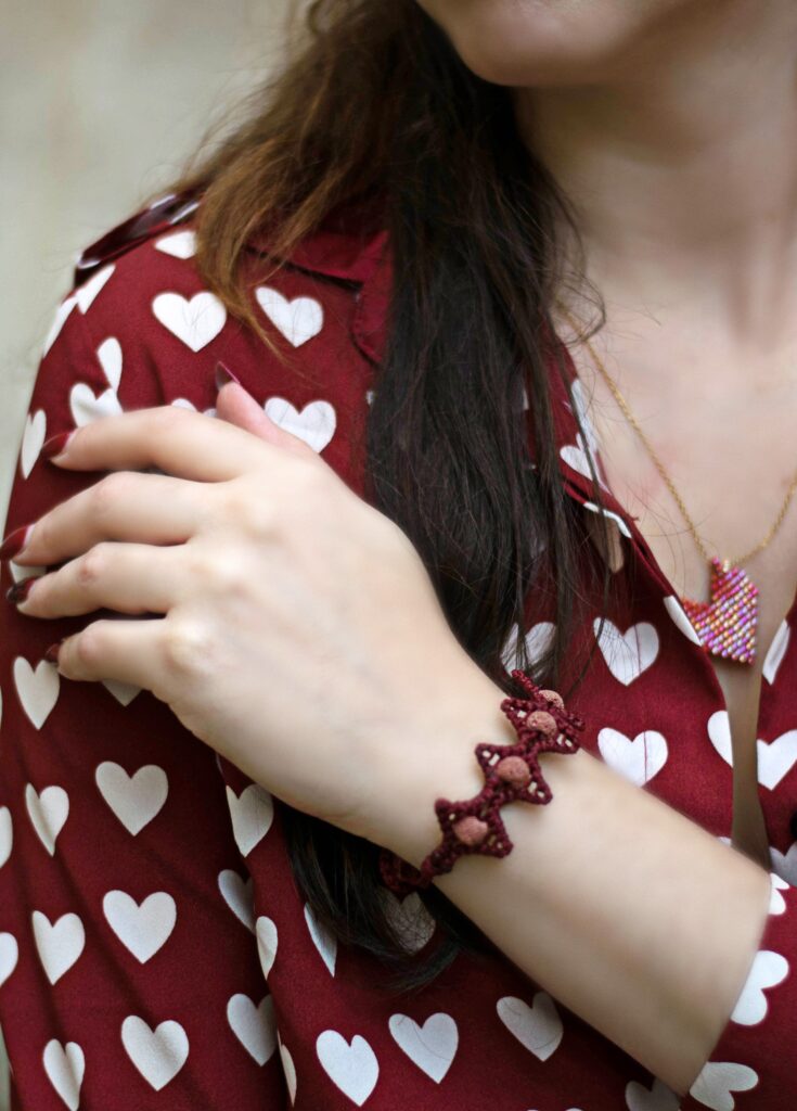 girl wears handmade lava stars macrame bracelet