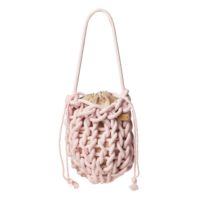 a handmade knitted wrist bag in baby pink color