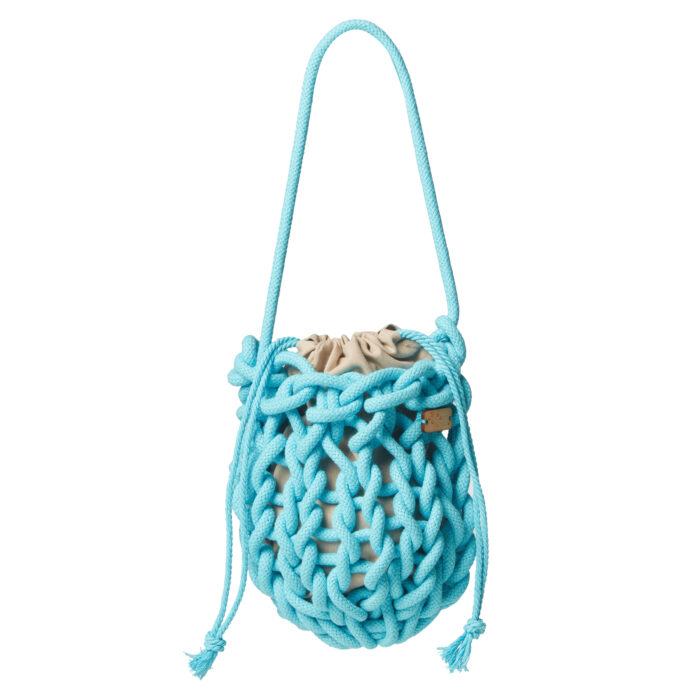 a handmade knitted wristed bag in sky blue color